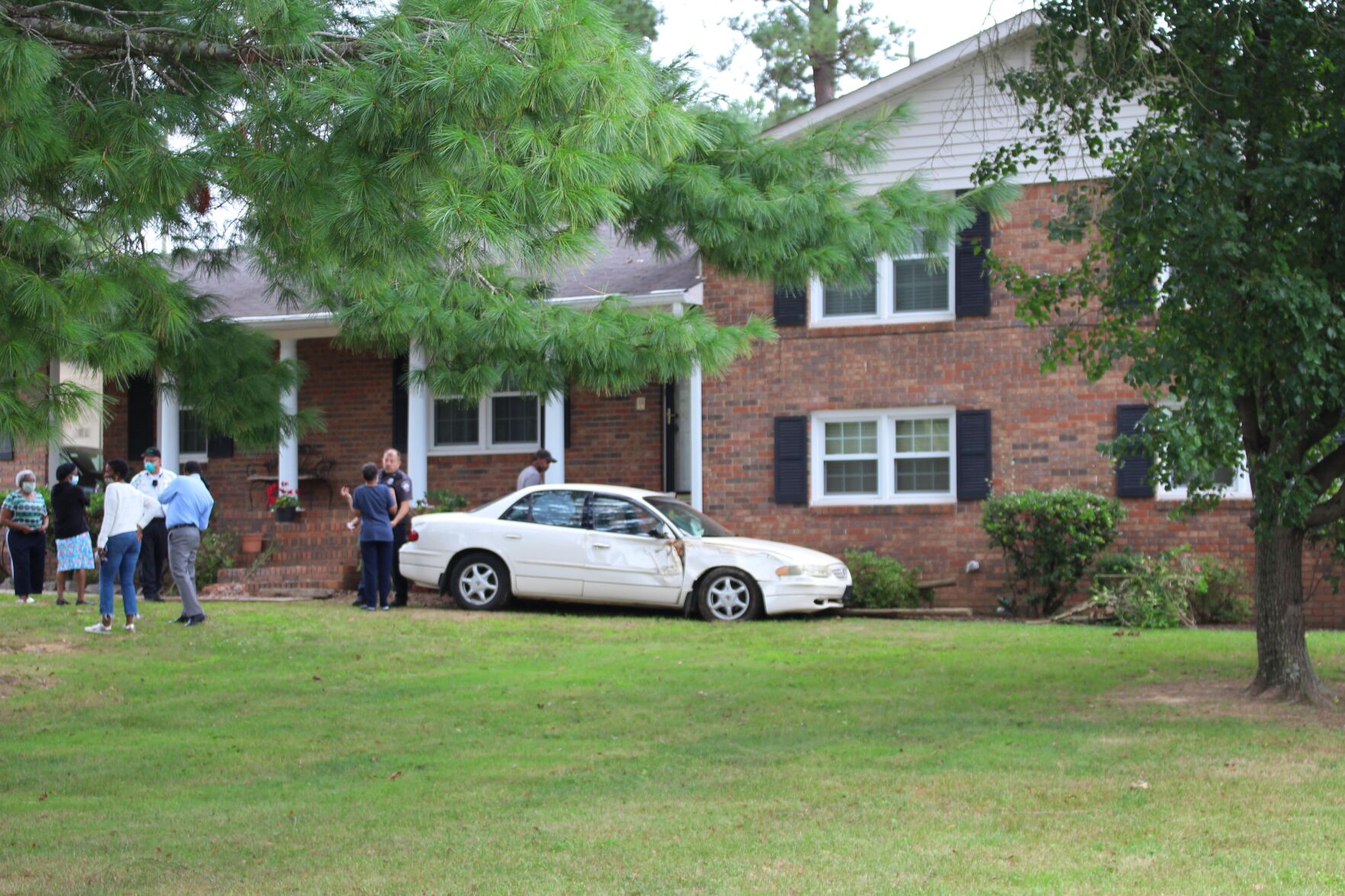 Car strikes house near Main Elementary School